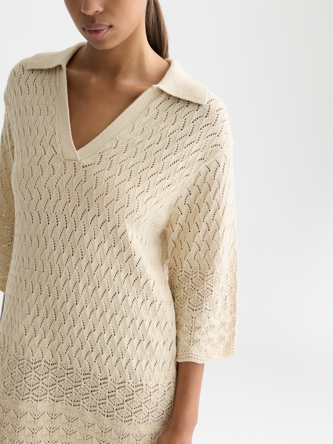 Pointelle knitted tunic dress by Scotch & Soda, featuring a textured pattern and relaxed fit, styled on a model.