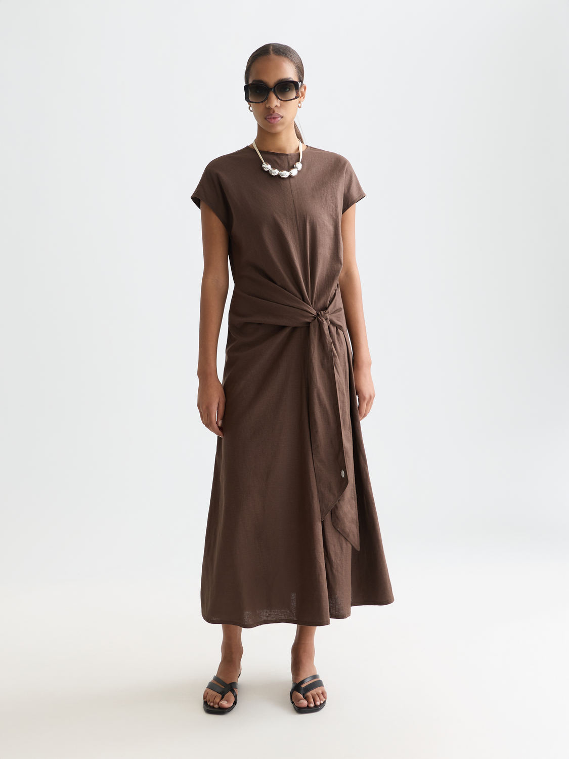 Linen-blend tie dress by Scotch & Soda featuring a stylish front tie, lightweight fabric, and casual elegant design.