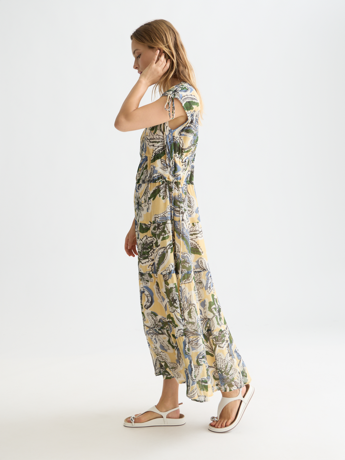 Printed maxi dress by Scotch & Soda featuring a flowing silhouette and vibrant floral pattern.