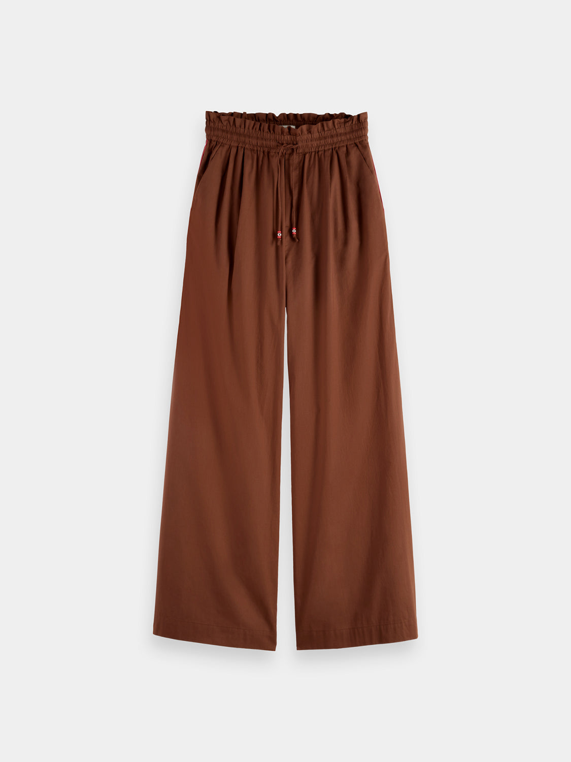 Light-colored cotton voile wide-fit pants from Scotch & Soda displayed on a hanger. Comfortable, breathable casual pants.