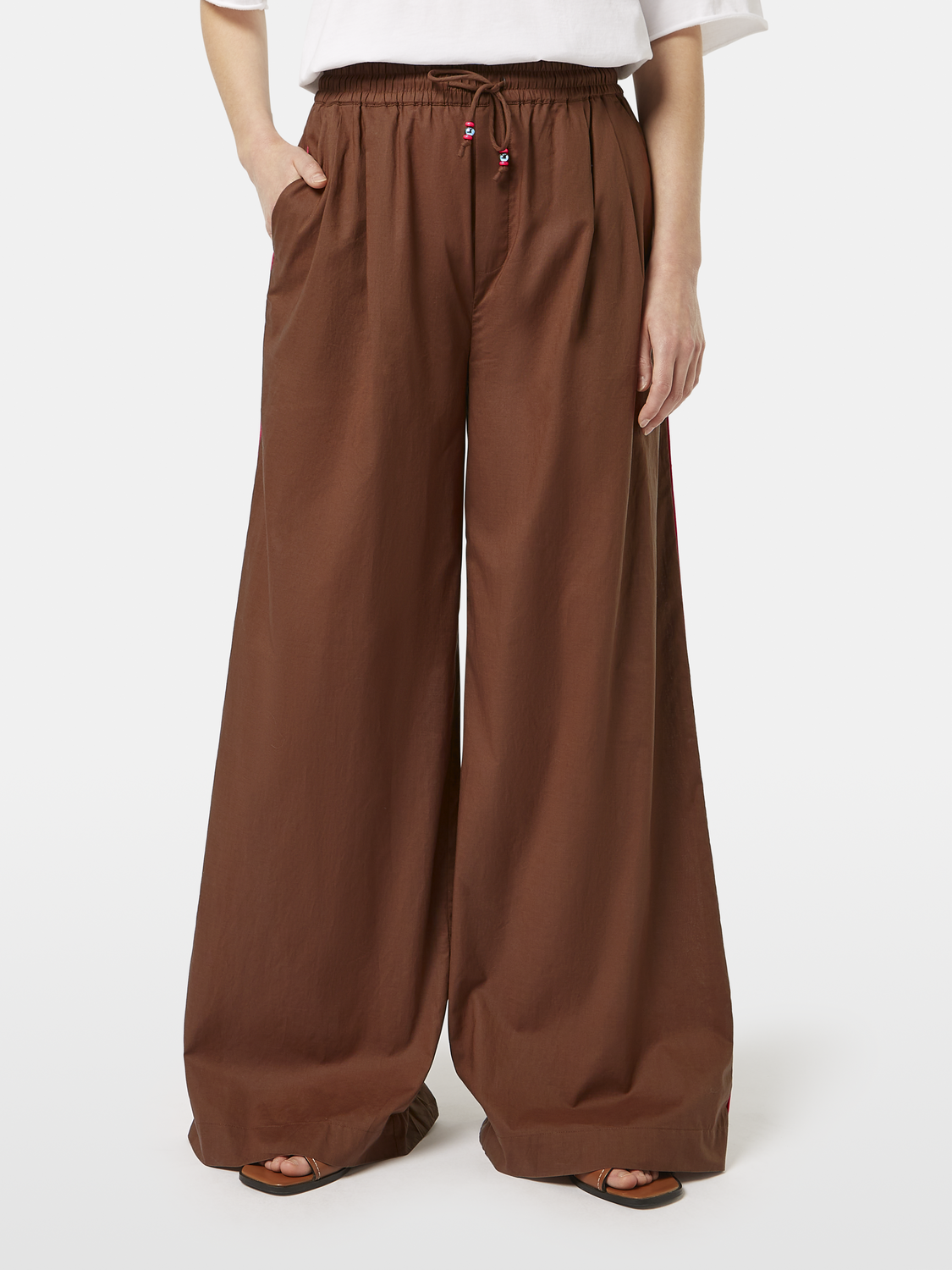 Cream cotton voile wide-fit pants by Scotch & Soda with a relaxed, flowy design and wide-leg silhouette.