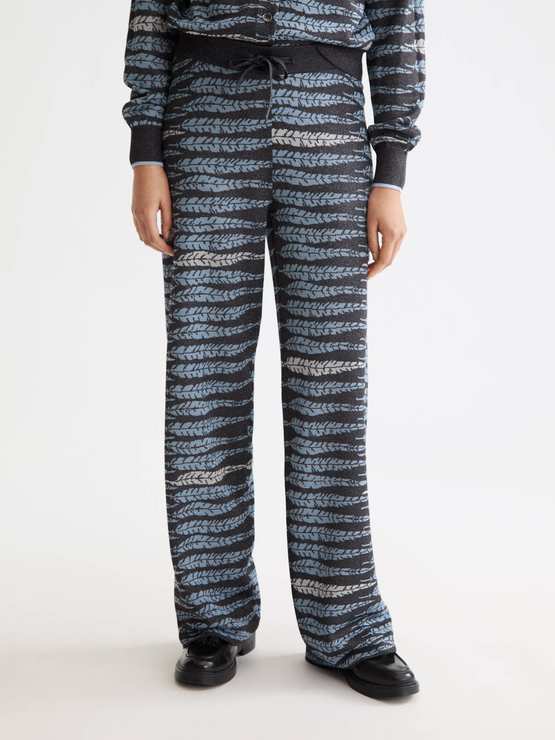 Scotch & Soda Lurex jacquard sweatpants with a shiny, textured pattern and relaxed fit, shown in front view.