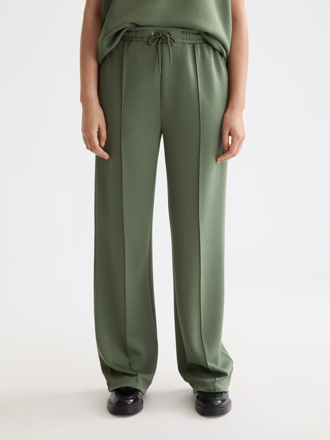 Light gray Scotch & Soda modal sweatpants with elastic waistband and relaxed fit, shown on a neutral background.