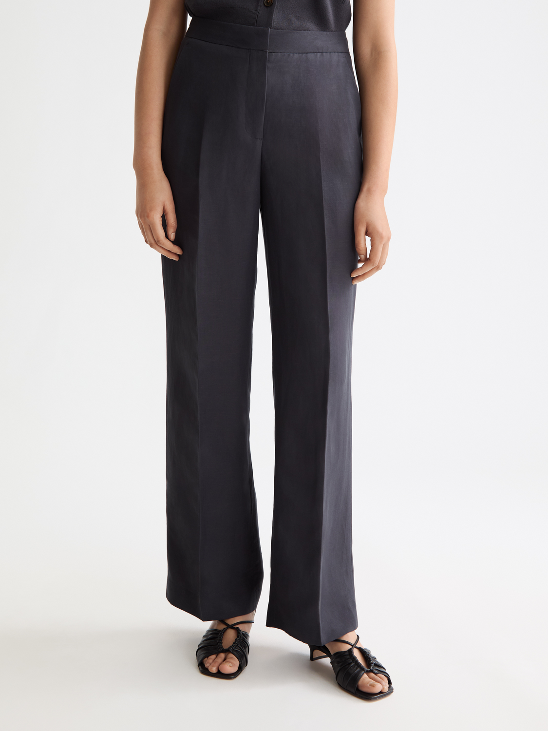 Wide-fit Edie pants by Scotch & Soda, shown in a stylish profile with a relaxed fit and modern design.