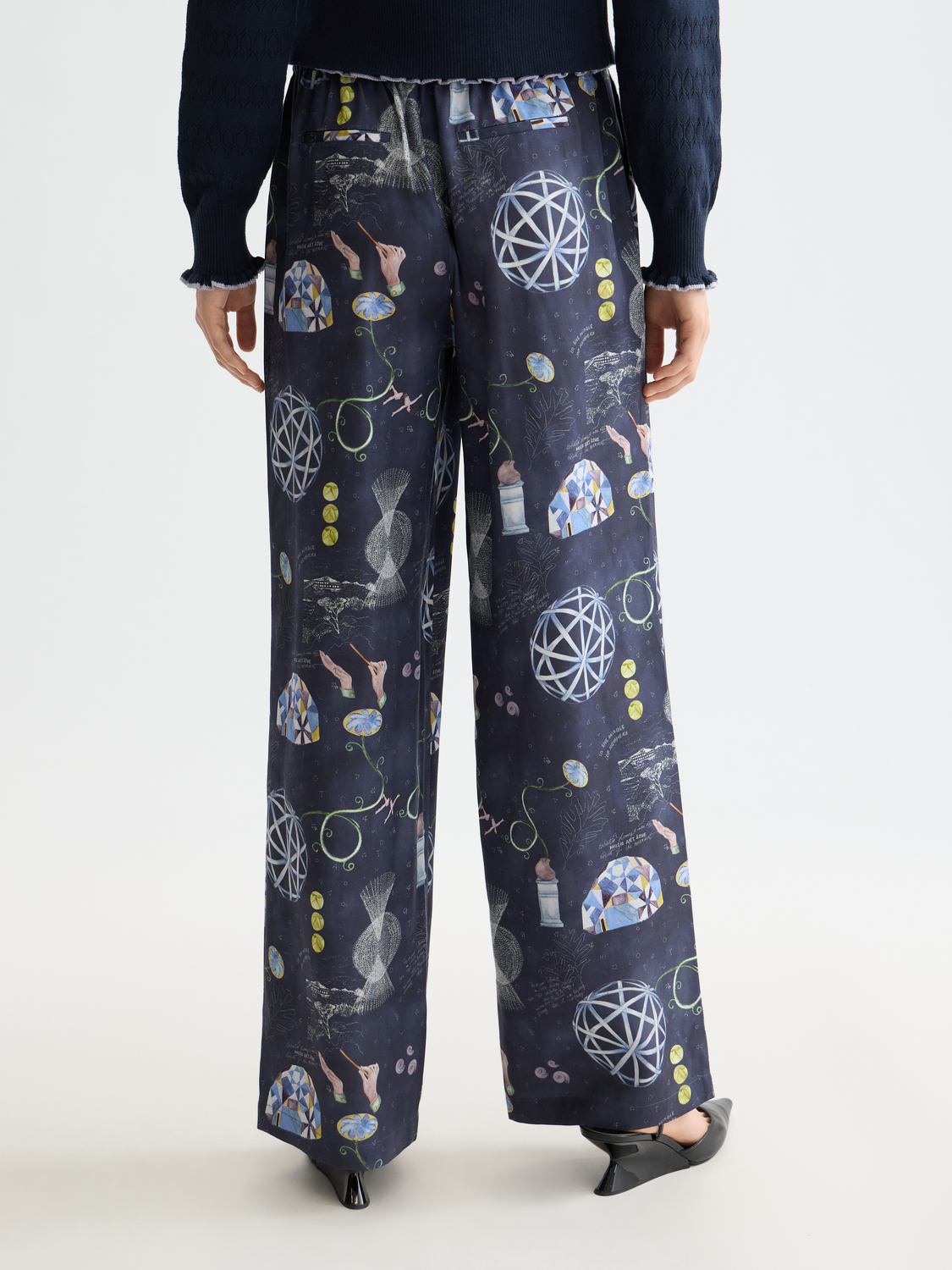Wide-fit Gia pants by Scotch & Soda, shown from the back, featuring a relaxed silhouette and subtle stitching details.