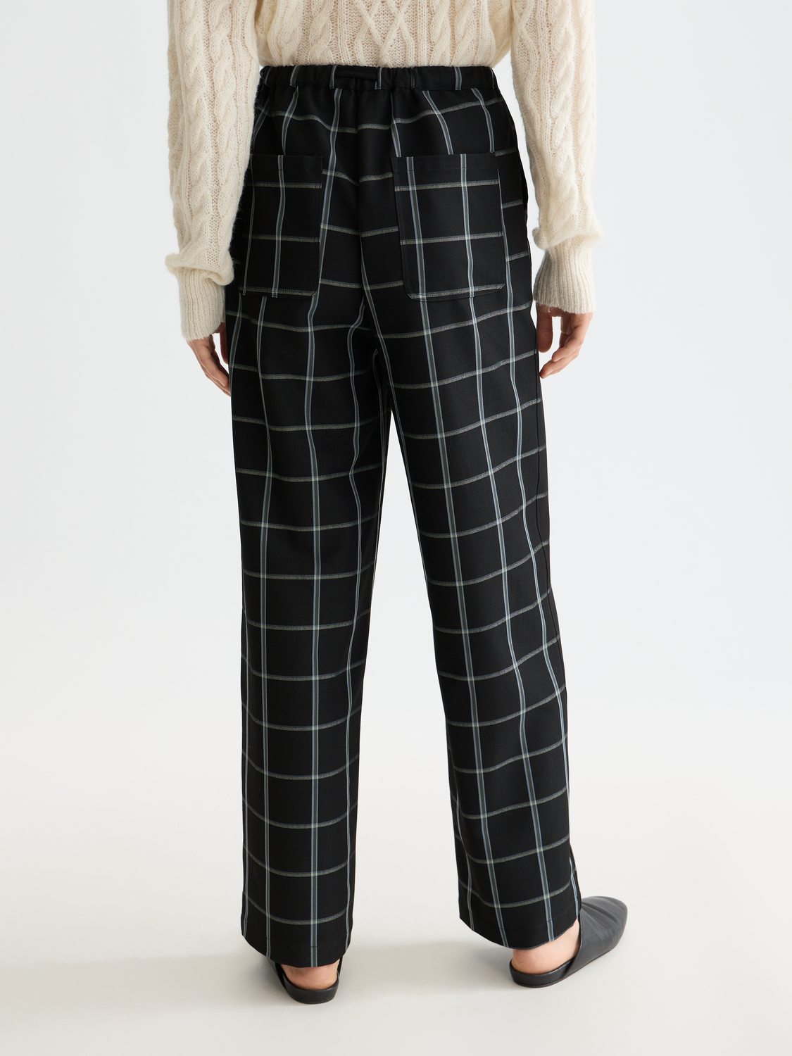 Black Ezra drawstring pants by Scotch & Soda, featuring relaxed fit with adjustable waist and casual style.