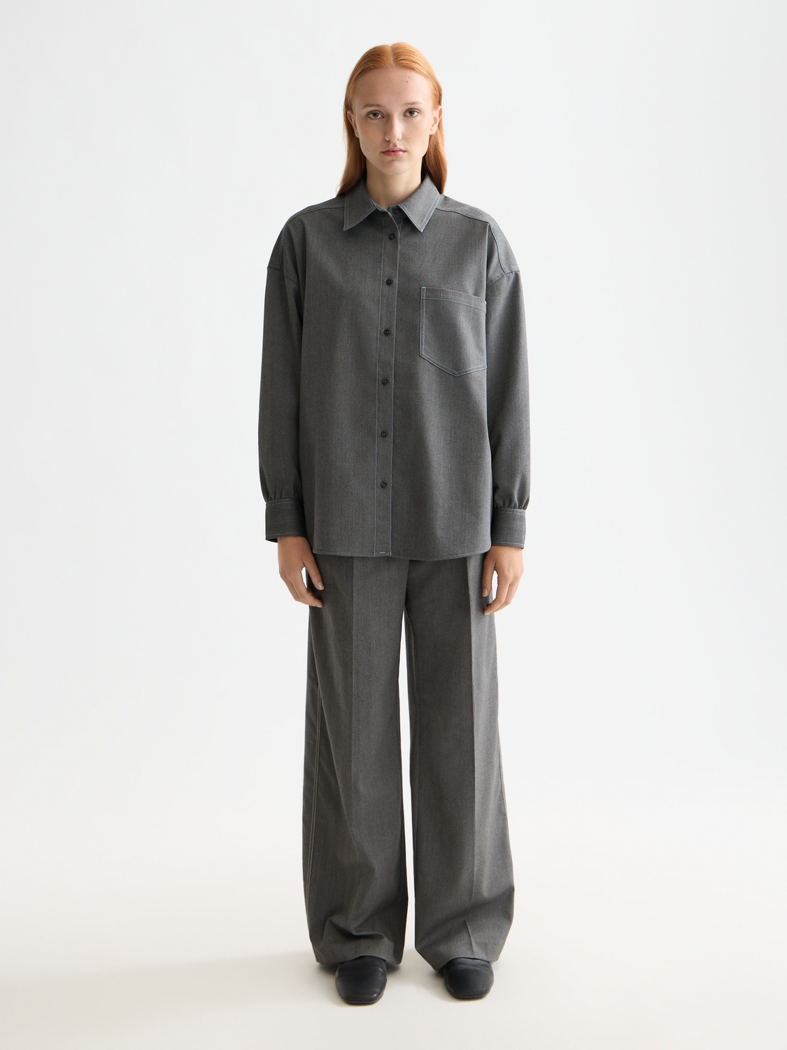 Wide-fit rose-colored pants by Scotch & Soda, featuring a relaxed style and casual fit, shown on a model.
