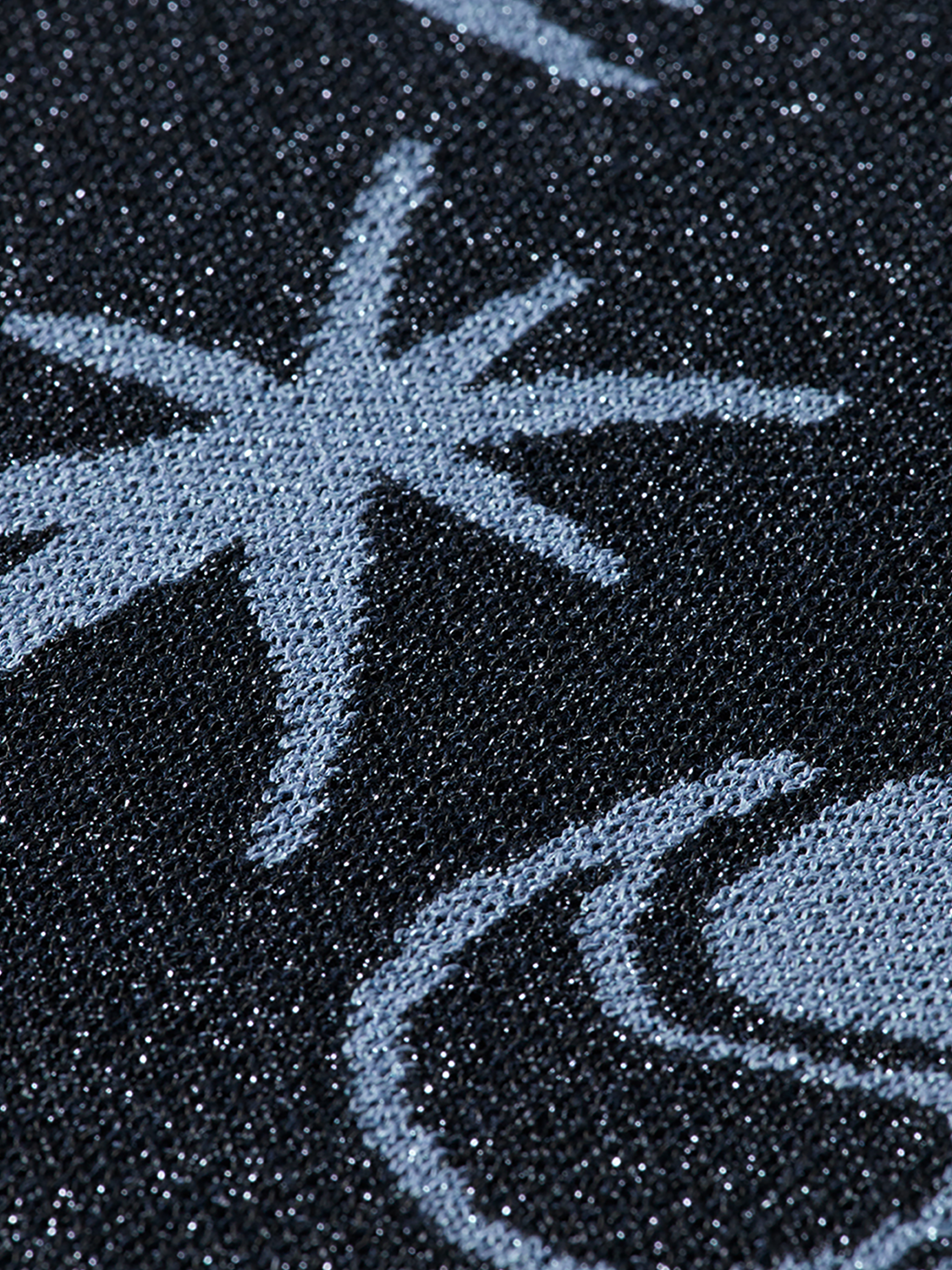 Jacquard knitted sweatpants by Scotch & Soda featuring a textured pattern and relaxed fit, shown in a neutral color.