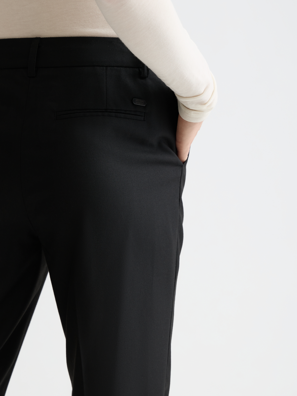Slim-fit Lowry pants by Scotch & Soda, featuring a tailored fit and classic design, shown on a model.