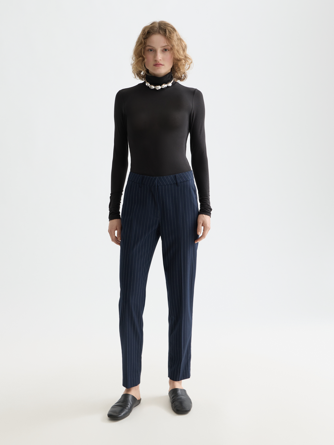 Slim-fit Lowry pants by Scotch & Soda, in a classic design, shown on a model with a neutral background.