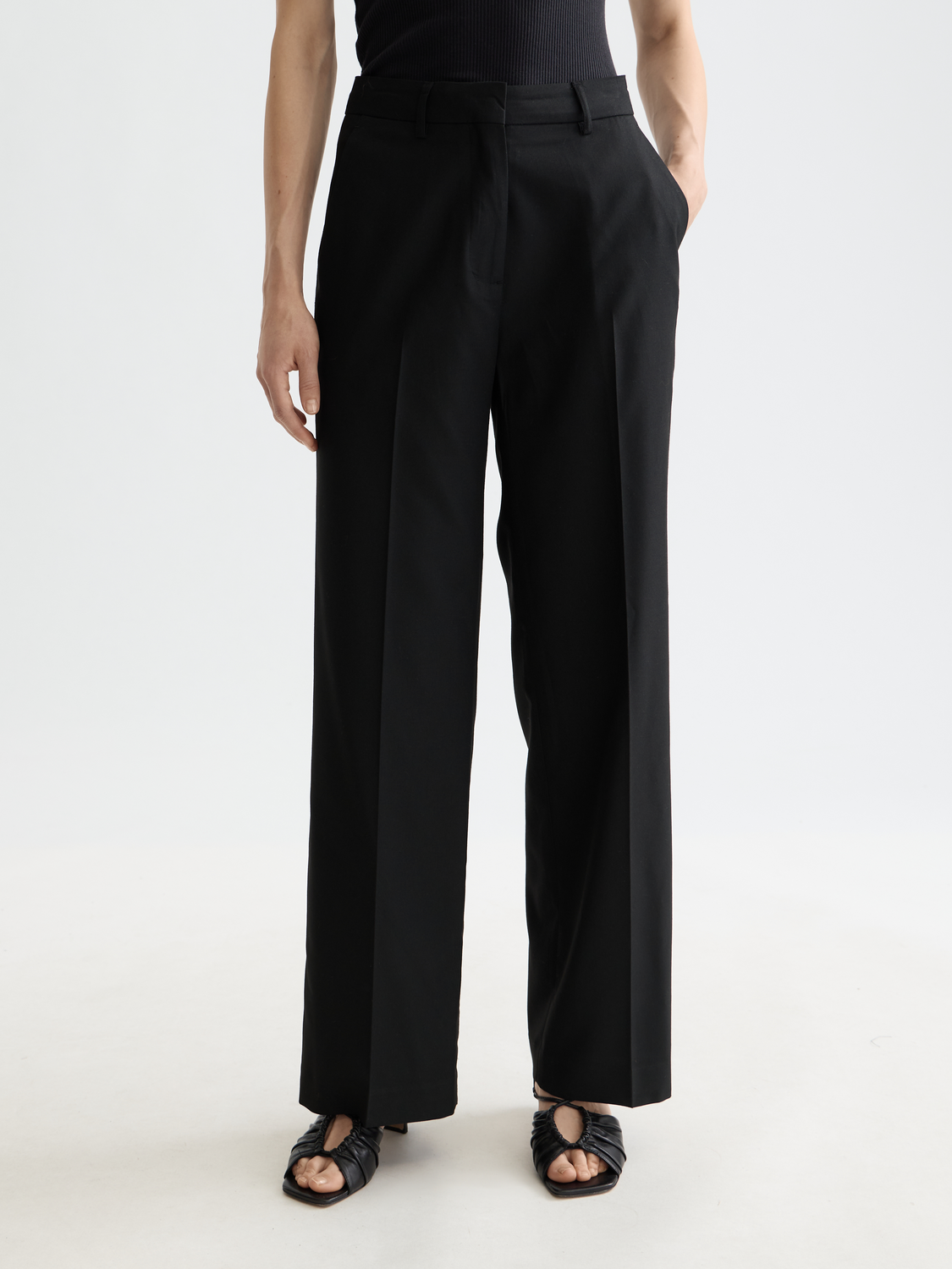 Wide-fit Edie pants by Scotch & Soda, featuring a relaxed fit and classic design, shown in a neutral color.