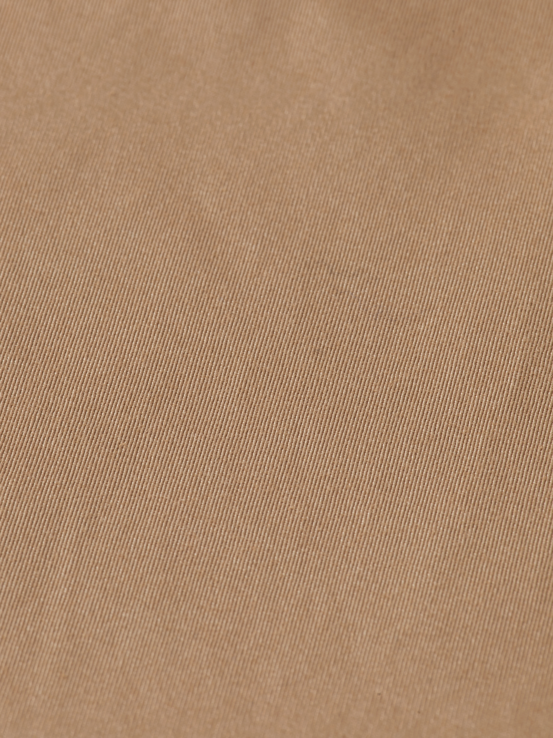 SCOTCH & SODA Abott tapered chinos pants in a neutral color, shown on a model with a close-up of the fabric and fit.