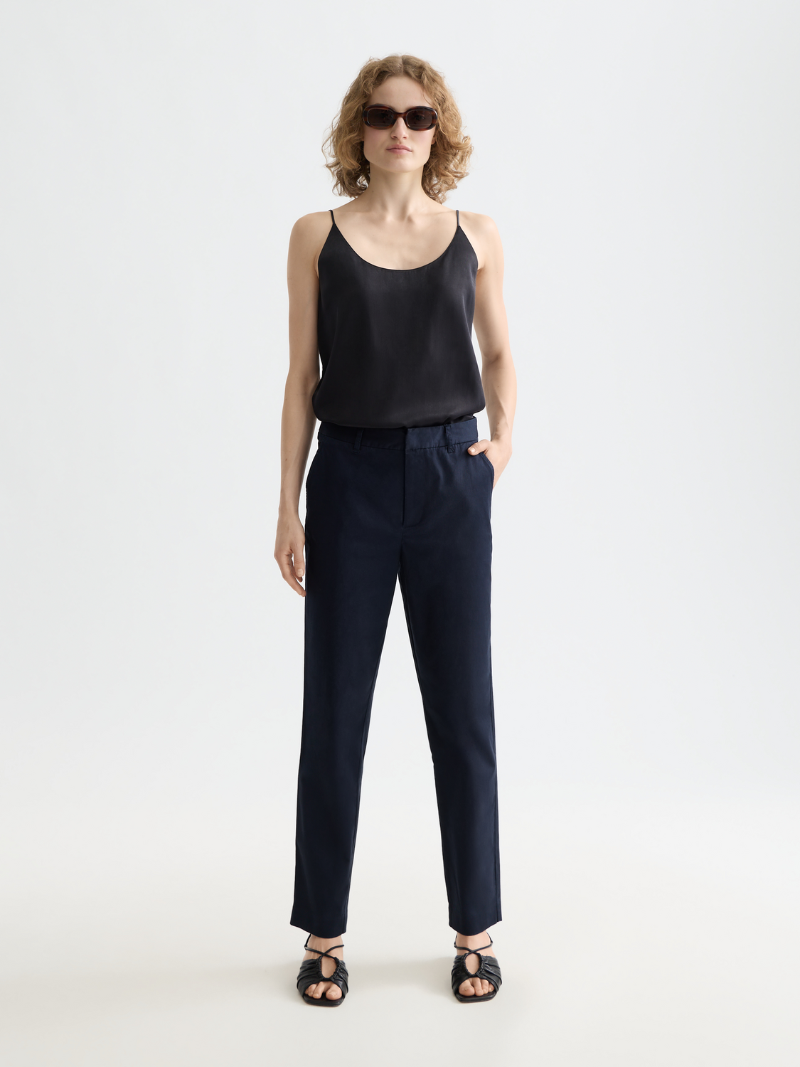 Scotch & Soda Abbott tapered chinos in beige, showing front view of slim-fit pants with belt loops and classic design.