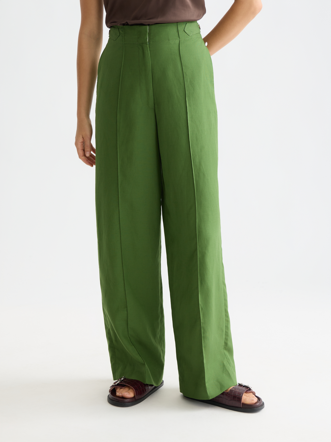 Wide-fit Lou pants by Scotch & Soda featuring a relaxed silhouette and neutral fabric, shown in a front view.