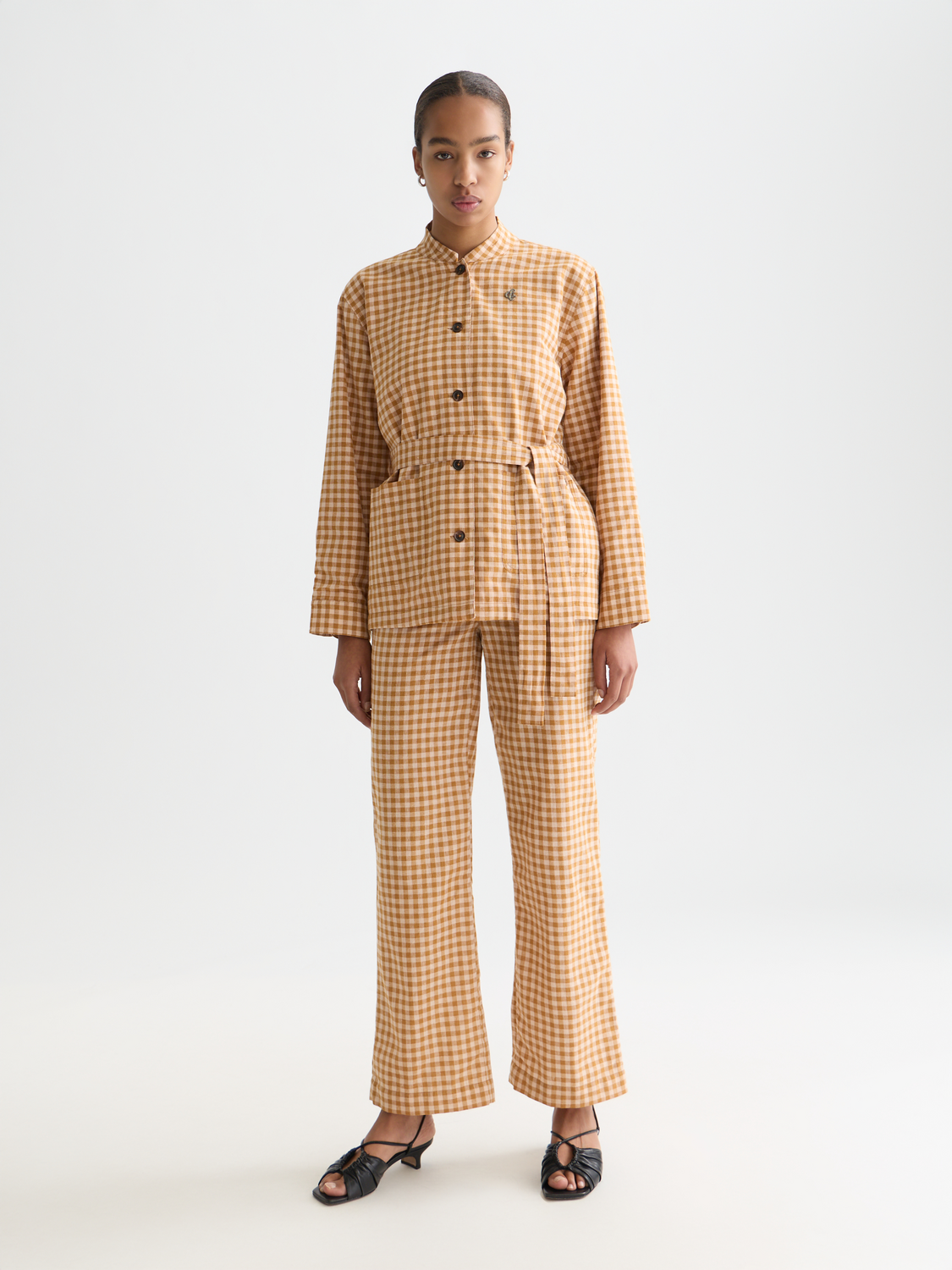 Wide-fit Edie pants by Scotch & Soda, shown in a neutral color, featuring a comfortable relaxed fit and classic design.