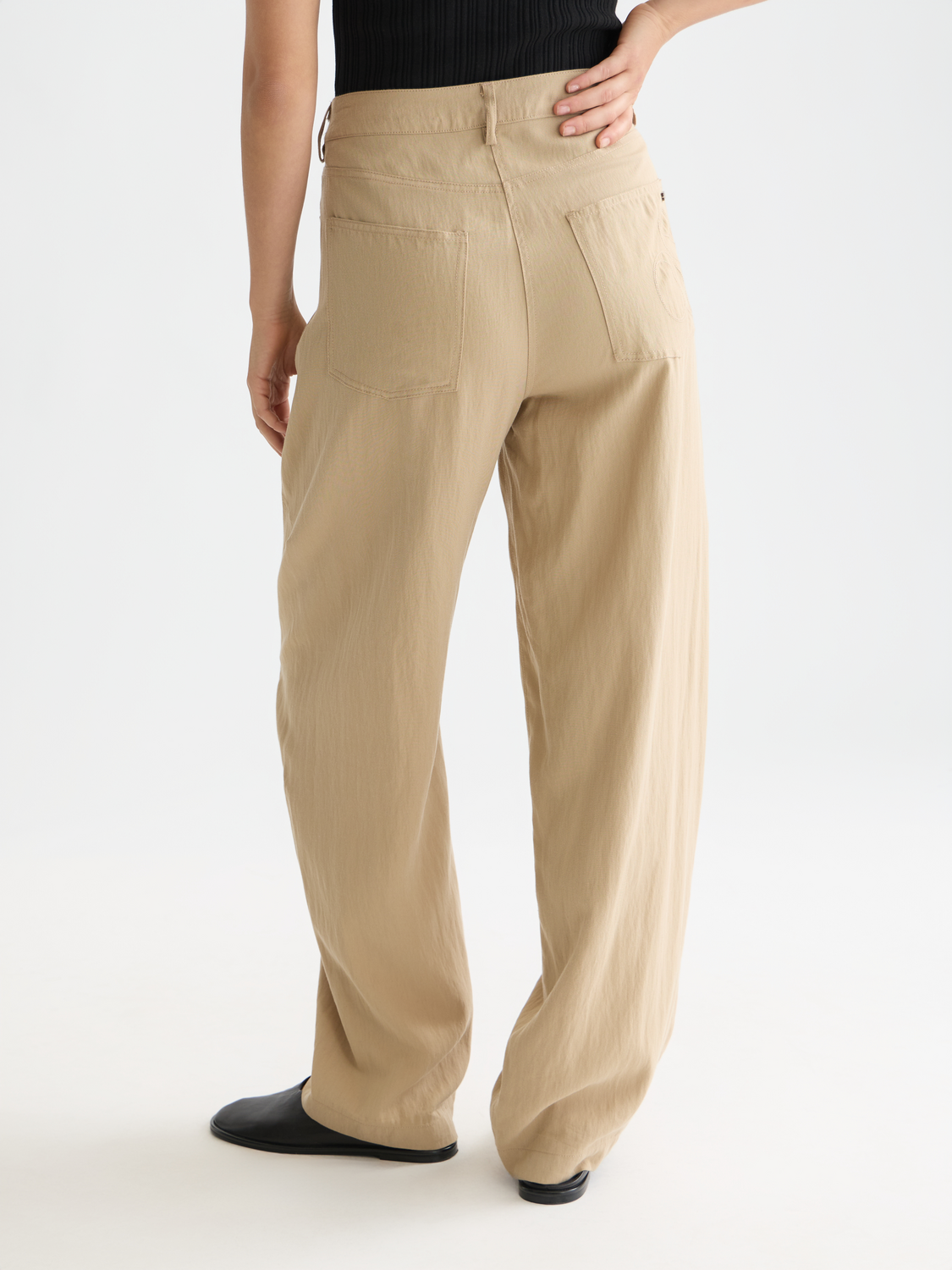 Lotus barrel leg pants by Scotch & Soda, featuring a relaxed fit and stylish design, shown from the back in this image.
