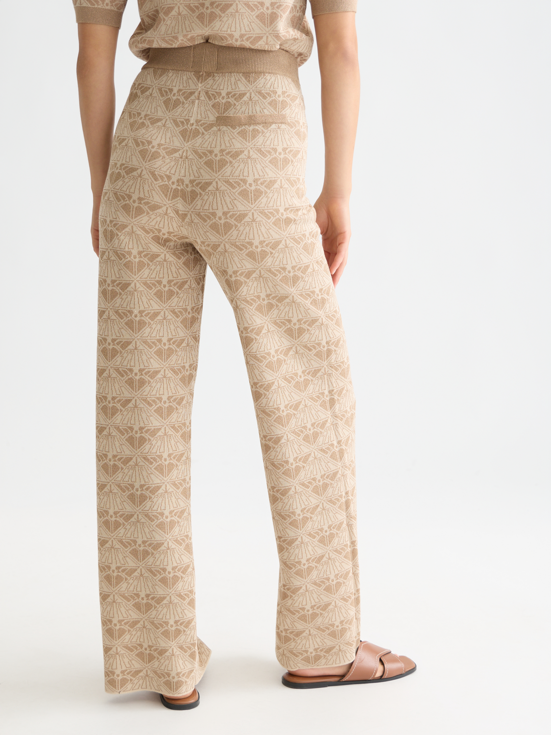 Jacquard knitted sweatpants by Scotch & Soda, back view showing intricate knit pattern and relaxed fit.