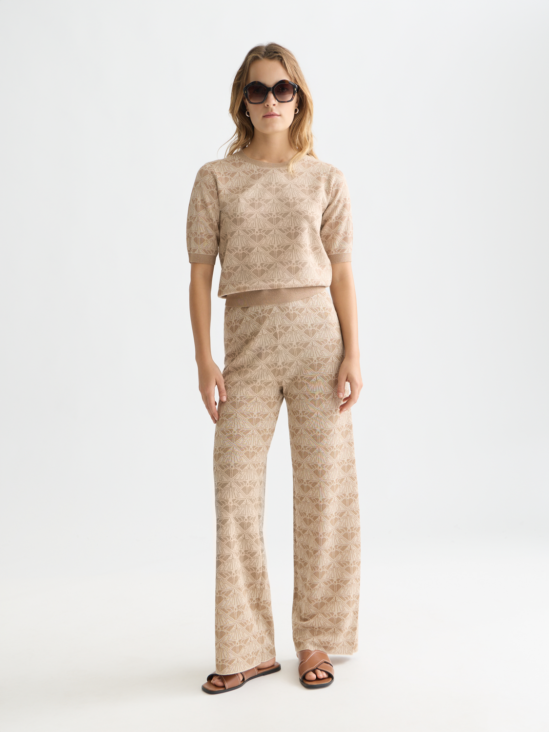 Jacquard knitted sweatpants by Scotch & Soda featuring a stylish pattern and relaxed fit, shown in the image.