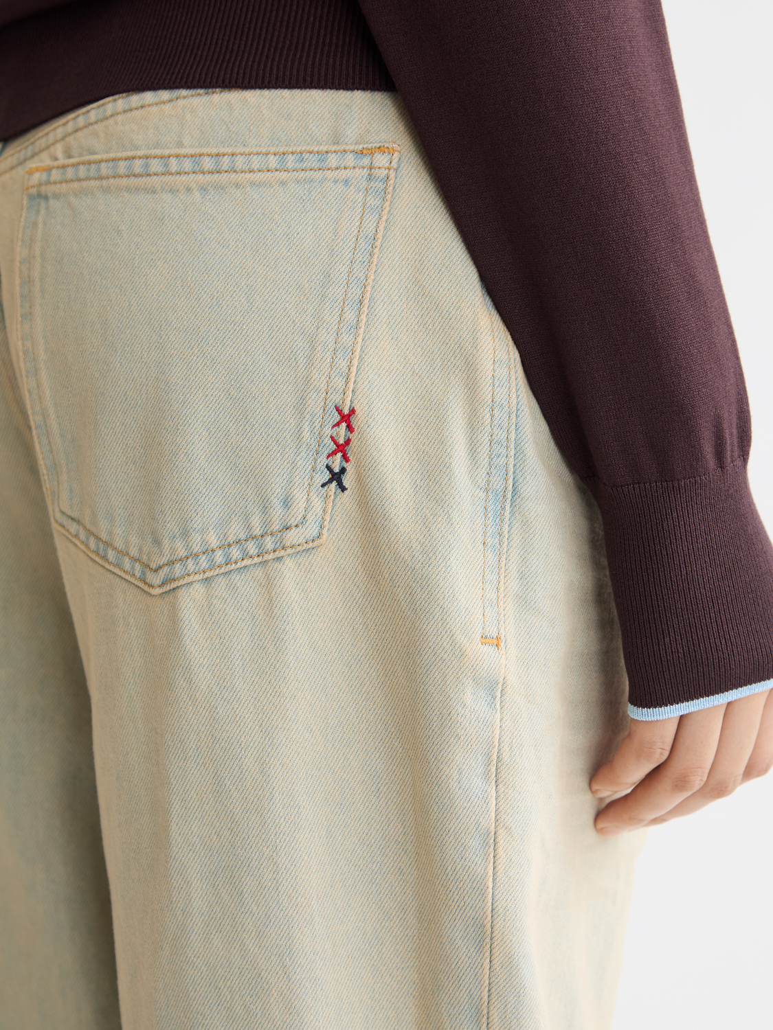 Deep loose-fit denim jeans by Scotch & Soda, showing relaxed fit and classic blue wash on a plain background.