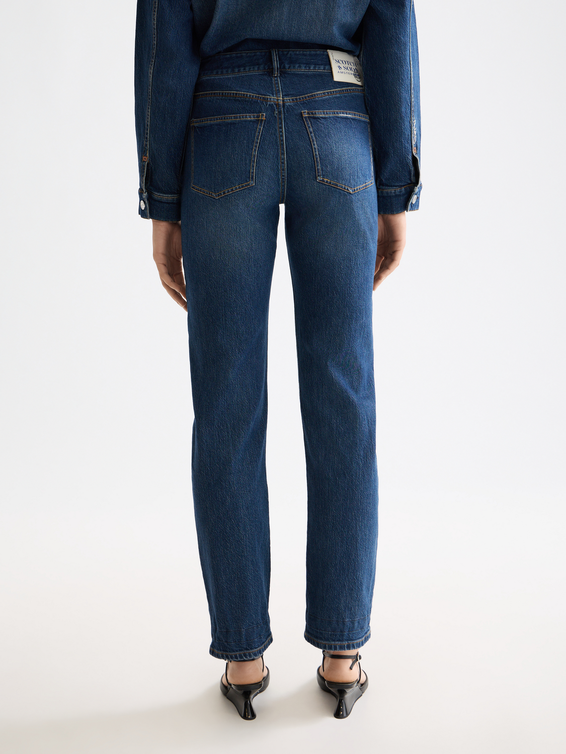 Dark blue Scotch & Soda Sky straight-fit denim jeans shown from the back, highlighting classic fit and stitching details.