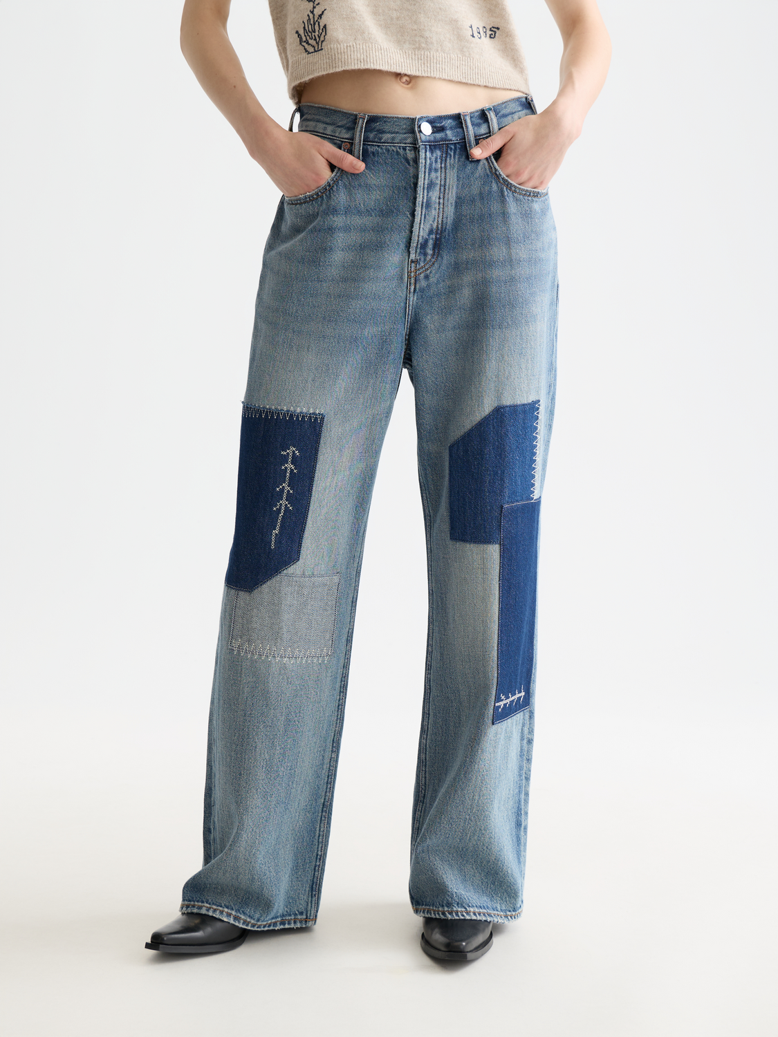 Deep loose-fit denim jeans by Scotch & Soda, showcasing a relaxed fit and classic indigo wash with detailed stitching.