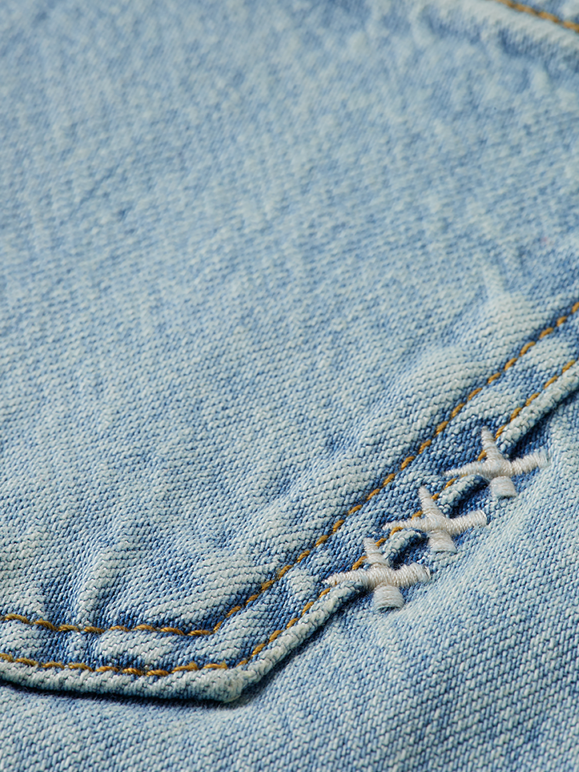 Sky straight-fit denim jeans by Scotch & Soda, showing the classic blue denim fabric and straight-leg cut on a hanger.