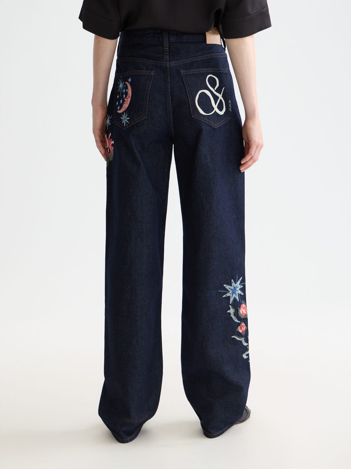 Dark blue Scotch & Soda Ripple straight-fit denim jeans with back pockets and subtle fading, displayed from the rear view.