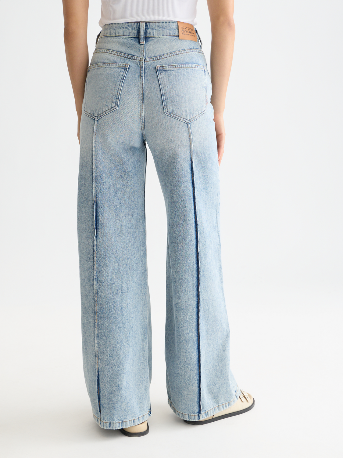 Wave wide-fit Scotch & Soda denim jeans shown from the back, featuring a classic five-pocket design and faded blue wash.
