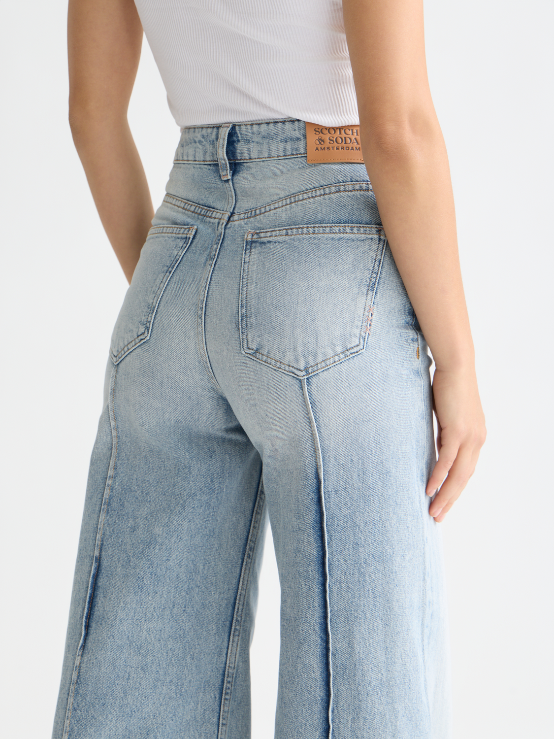 Wave wide-fit denim jeans by Scotch & Soda, featuring a relaxed fit and classic denim texture, shown on a model.