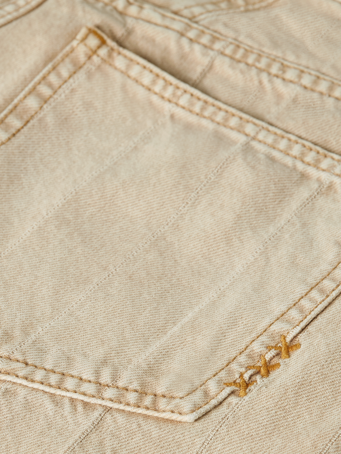 SCOTCH & SODA denim Loop barrel leg jeans showing the relaxed fit, classic five-pocket design, and distressed details.