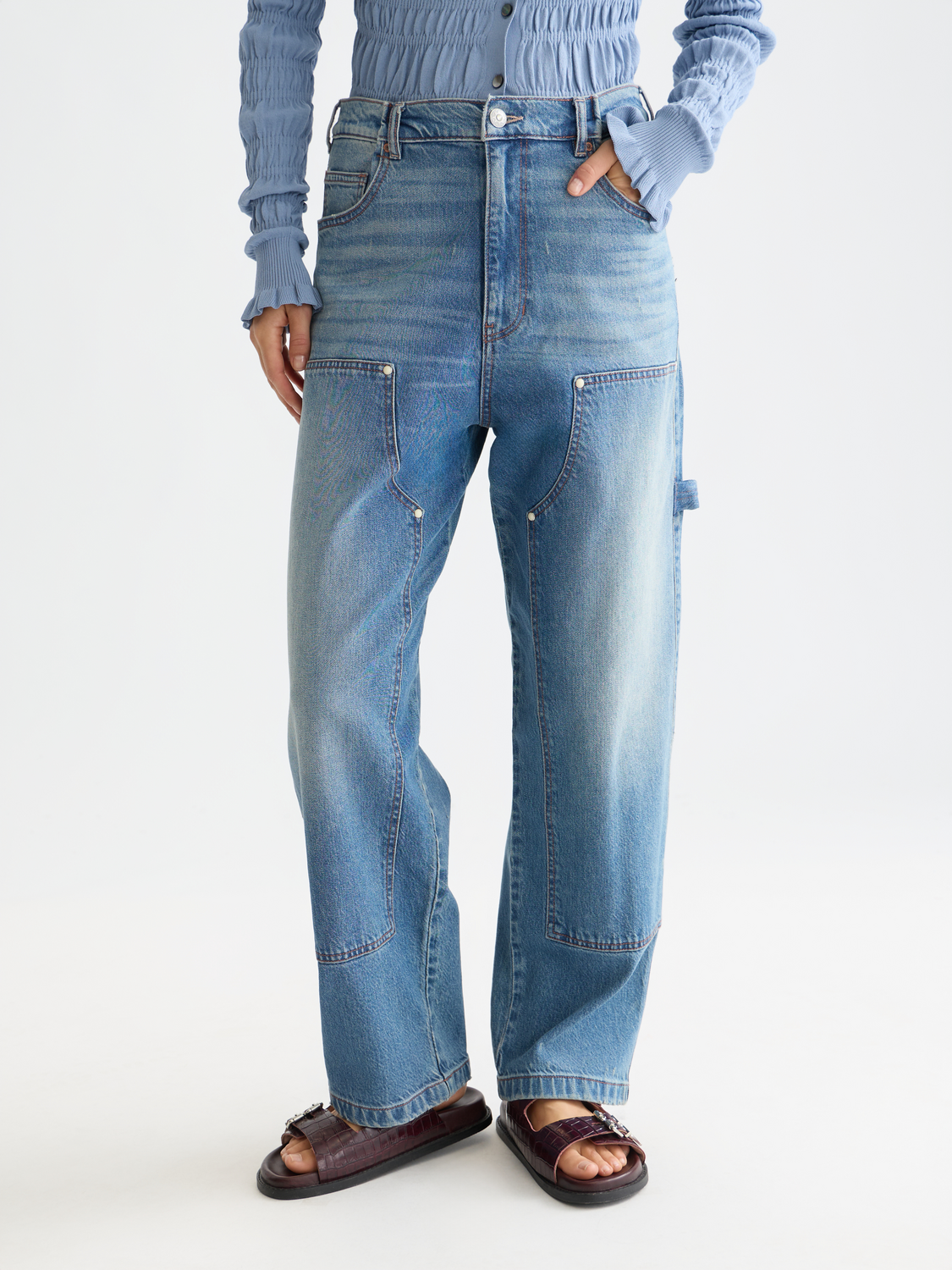 Scotch & Soda Raine wide-fit denim jeans shown on a model, featuring classic five-pocket design and light wash finish.