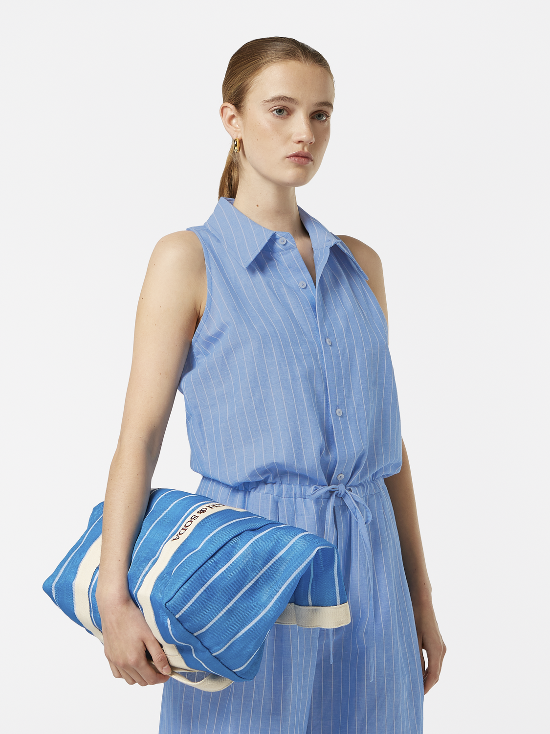 Striped linen jumpsuit by Scotch & Soda featuring a relaxed fit, sleeveless design, and breathable fabric for casual wear.