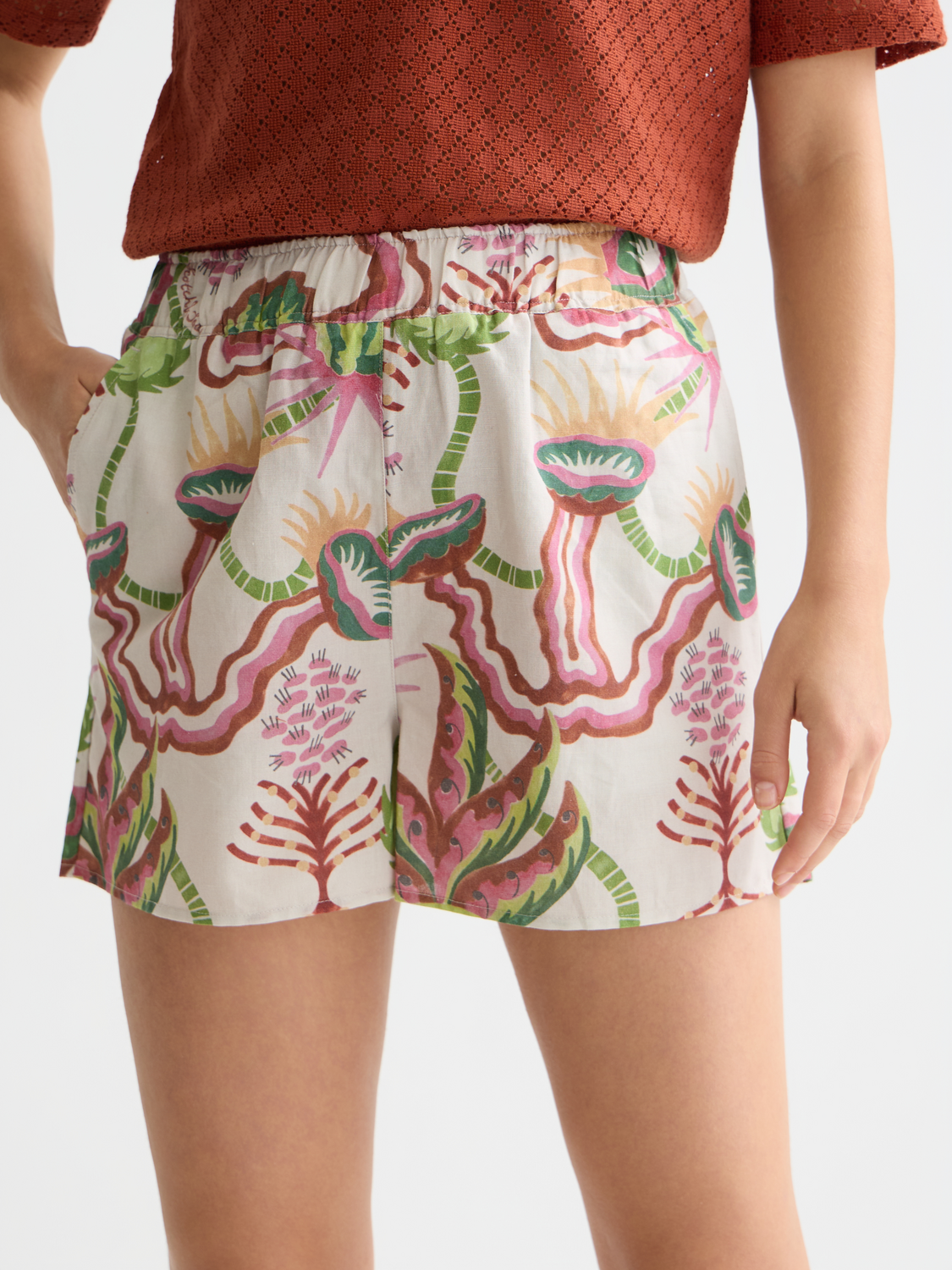 Light beige cotton-linen shorts by Scotch & Soda, featuring a relaxed fit and casual style, shown on a model.