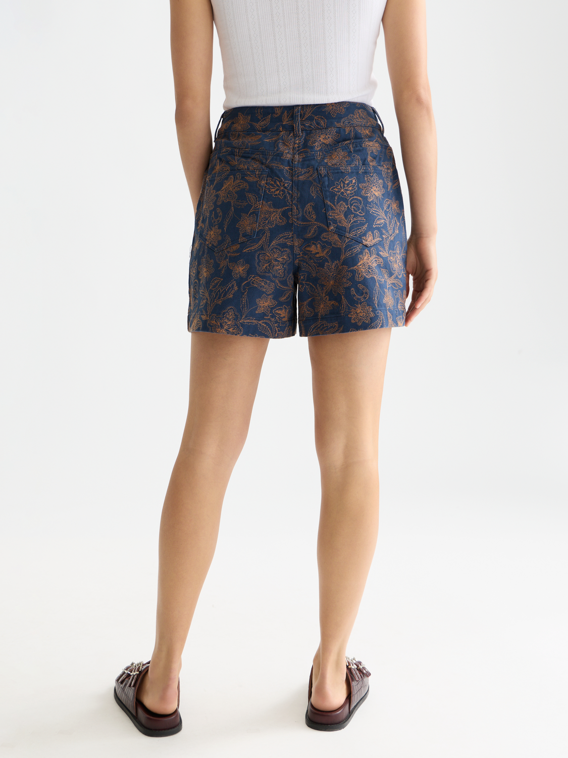 Embroidered shorts by Scotch & Soda featuring colorful floral embroidery, back view with relaxed fit and casual style.