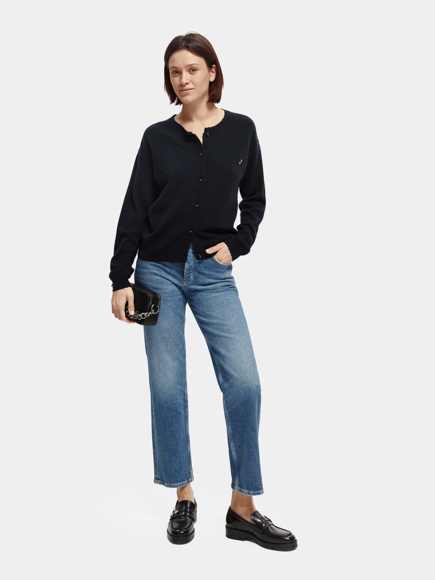 Sky straight fit denim jeans by Scotch & Soda, showing classic blue color, front view with pockets and belt loops.