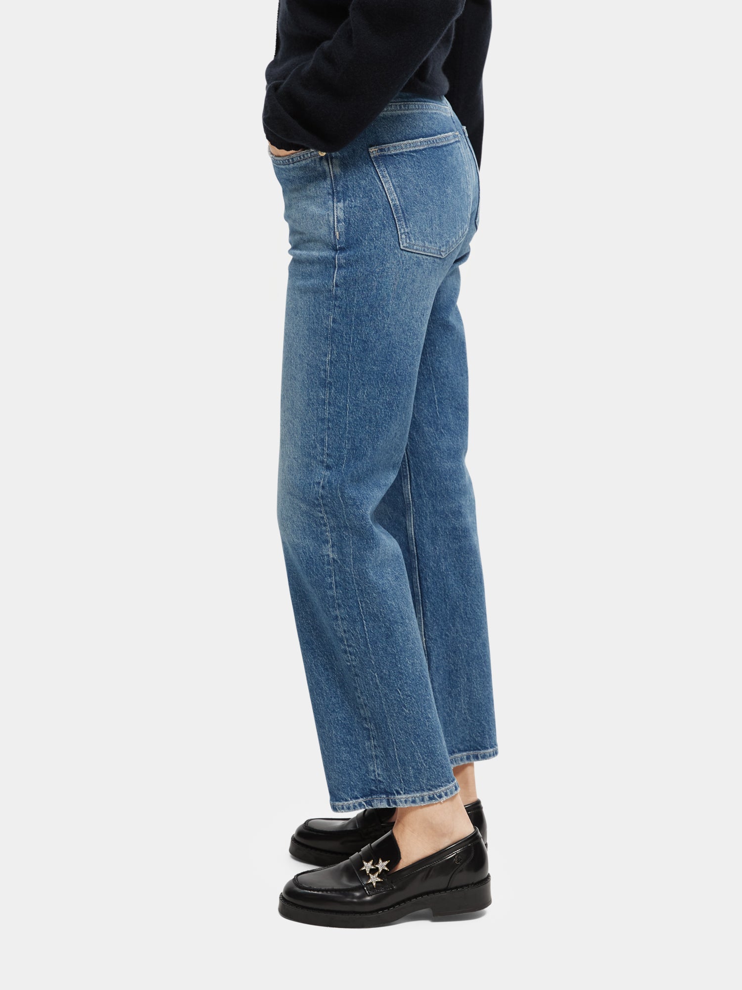 Sky straight fit denim jeans by Scotch & Soda, showing the classic blue color, front view with belt loops and pockets.
