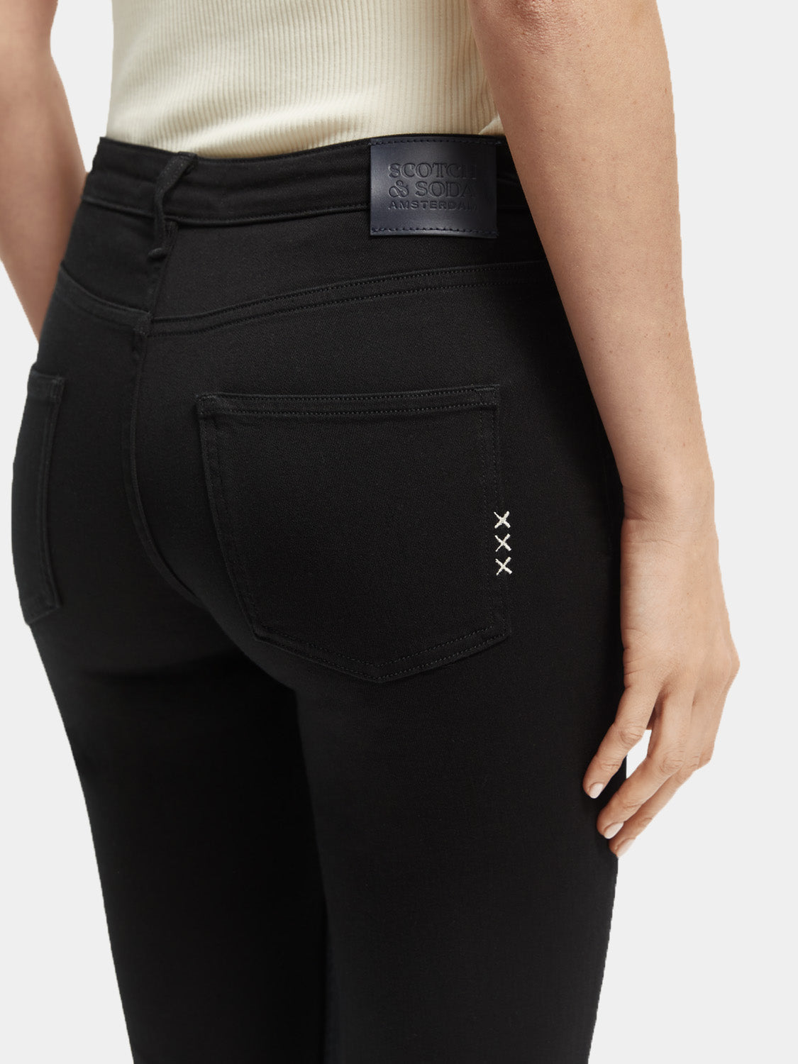 Skinny fit denim jeans by Scotch & Soda, shown in dark wash with classic five-pocket design and slim silhouette.