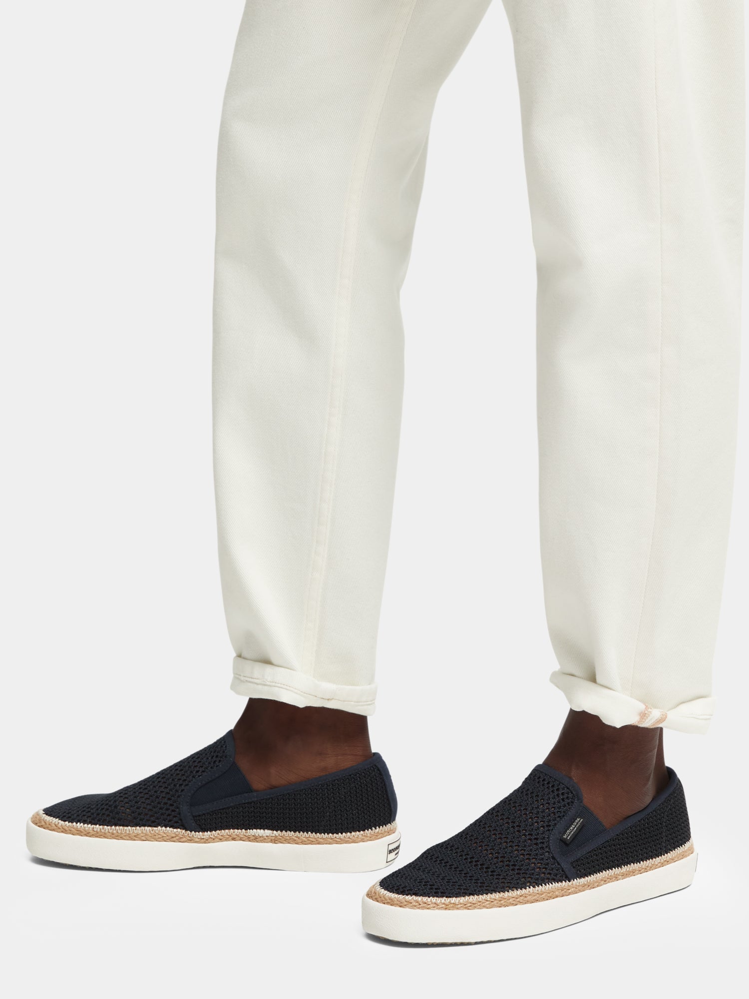 Scotch & Soda Izomi slip-on shoe featuring a sleek design and comfortable footwear style, shown in a stylish close-up image.