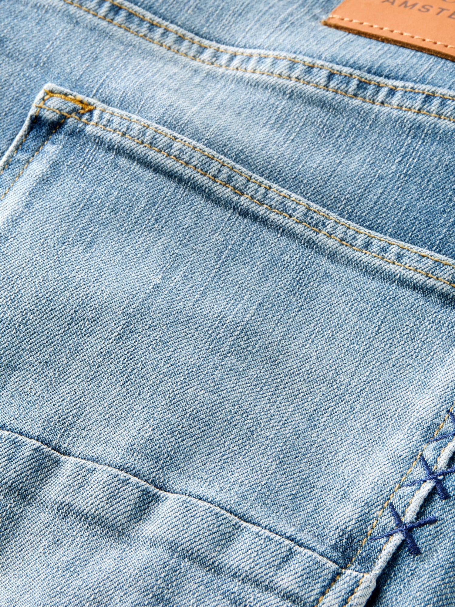 Scotch & Soda Ralston slim fit denim jeans showing front view with classic five-pocket design and dark wash finish.