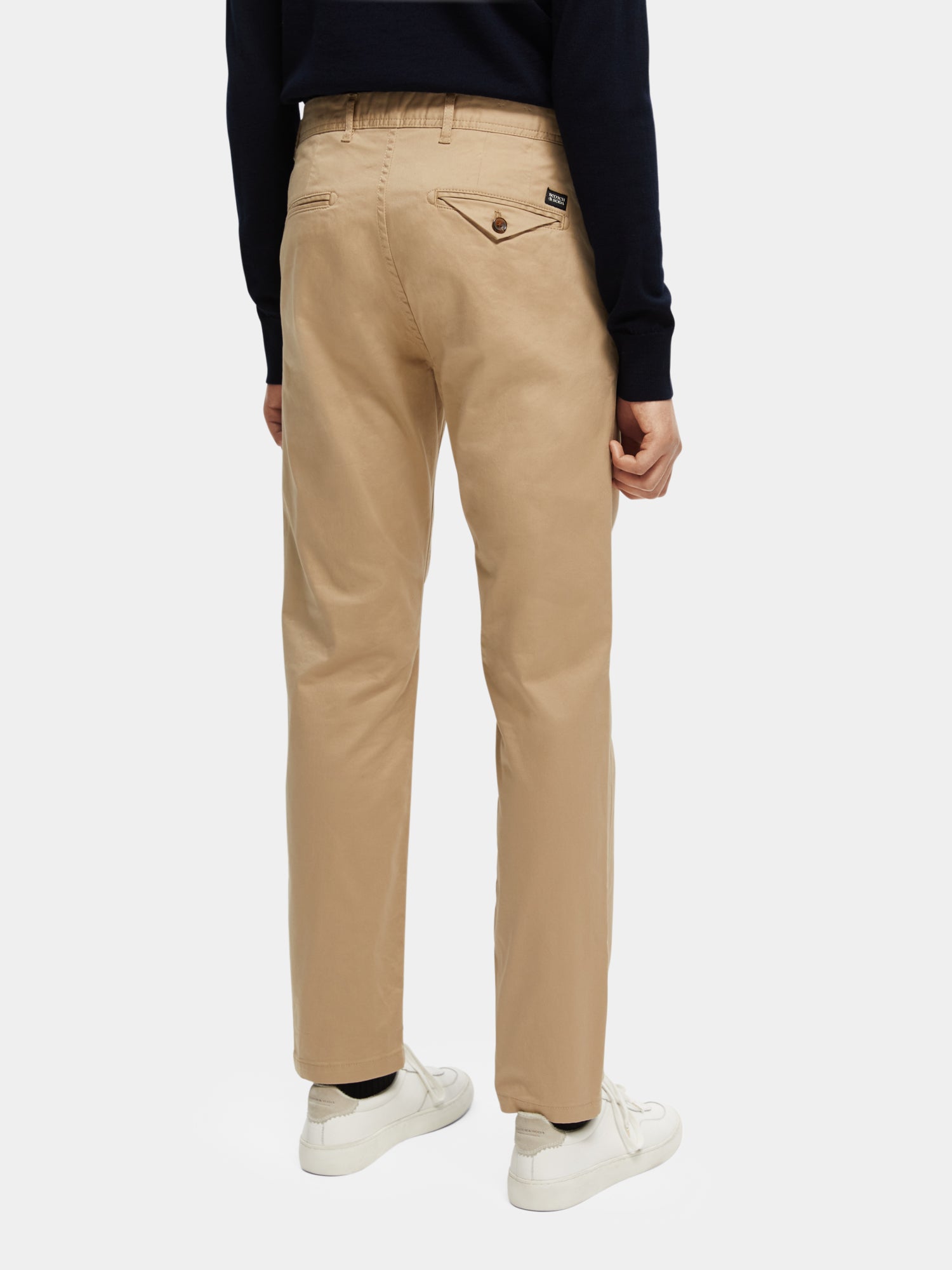 Navy Scotch & Soda Stuart slim fit chinos pants displayed from the back view, showing the tailored fit and back pockets.