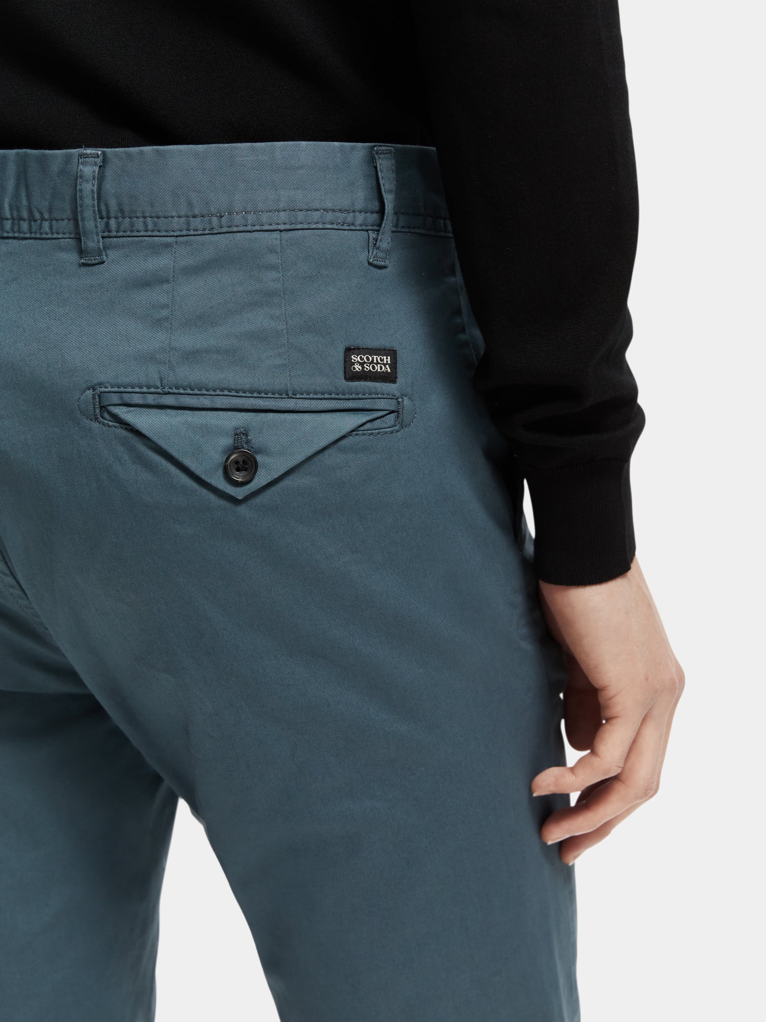 Slim fit Scotch & Soda Stuart chinos in neutral color, showcasing tailored pants with front and back pockets.