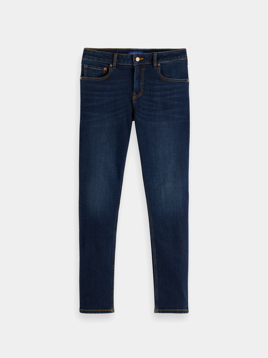 Skim skinny-fit denim jeans by Scotch & Soda, featuring a classic five-pocket design and dark wash fabric.