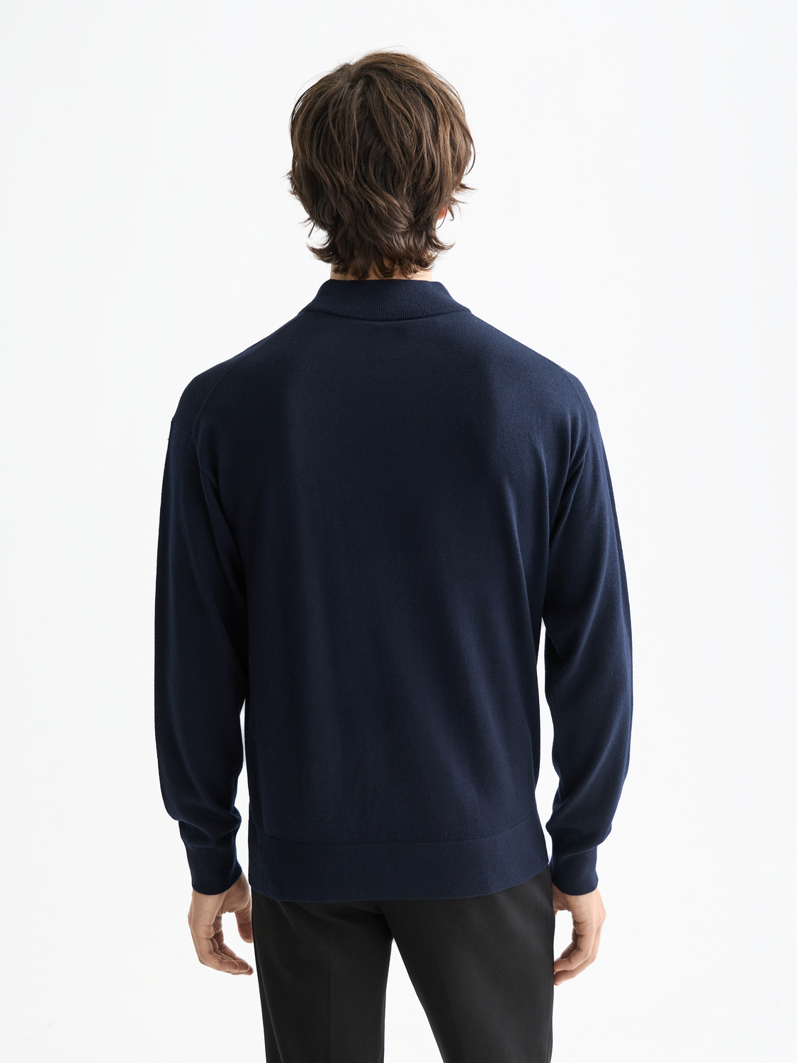 Black knit mock neck sweater by Scotch & Soda, featuring a cozy, fitted design with ribbed collar and long sleeves.
