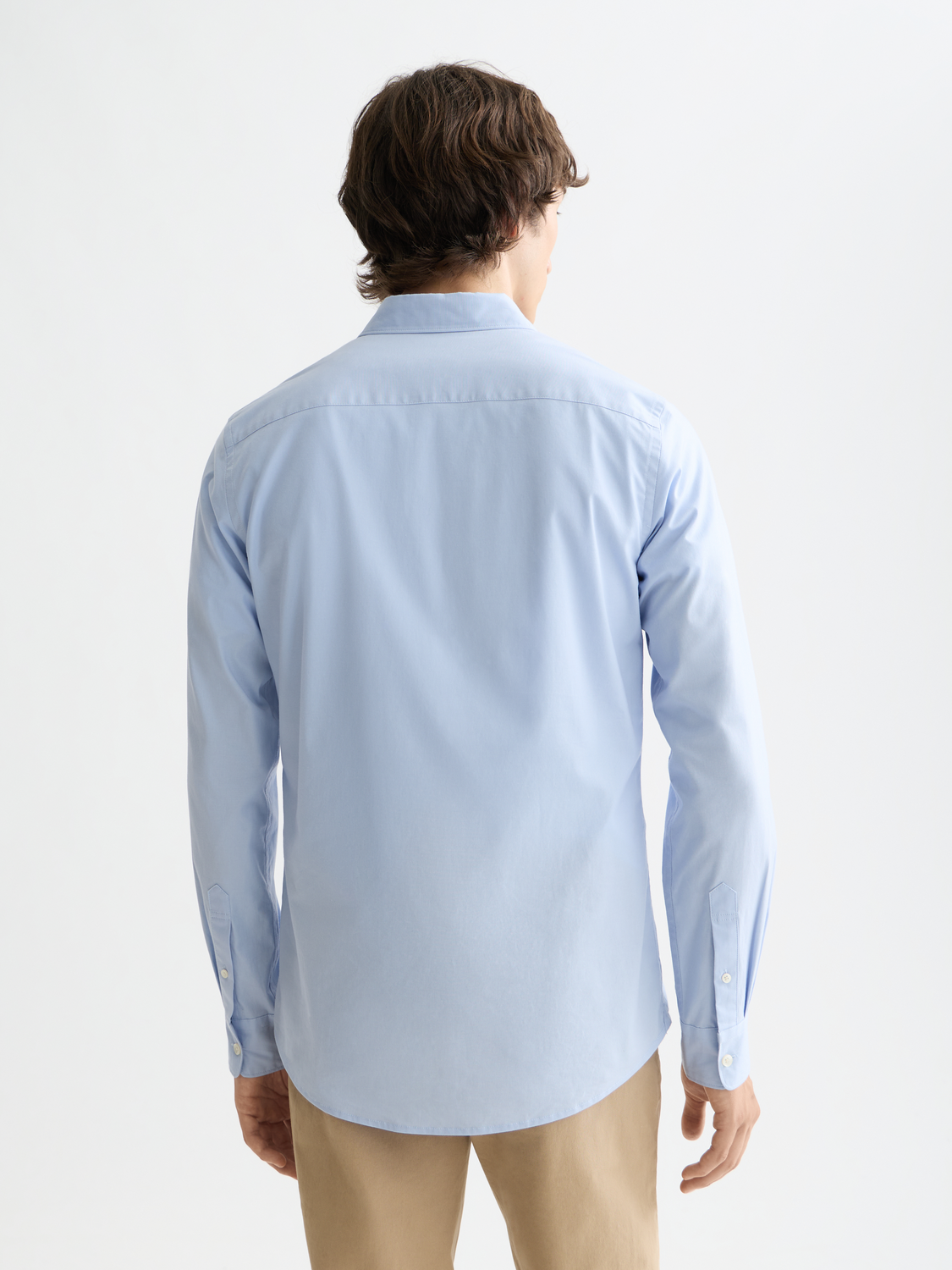 Long sleeve poplin shirt by Scotch & Soda with a dark checkered pattern and classic collar, displayed flat.