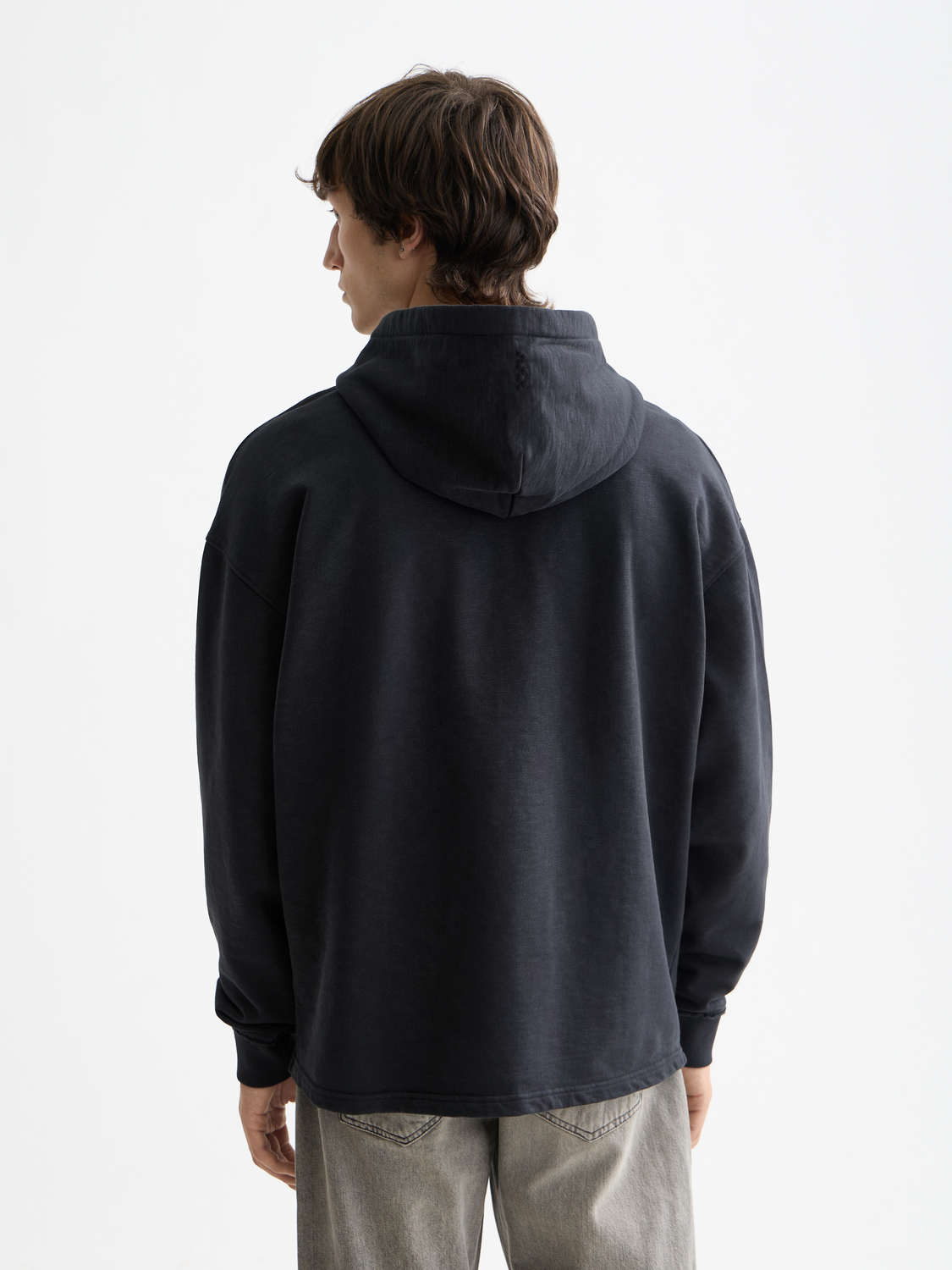 Black embroidered logo hoodie from Scotch & Soda, featuring a comfortable sweatshirt design with a prominent brand logo on the front.