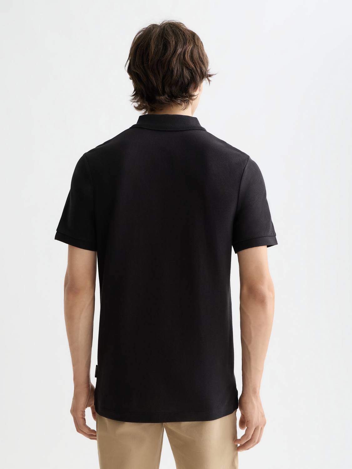 Black Scotch & Soda logo pique polo shirt with a classic collar and short sleeves, featuring embroidered branding on the chest.