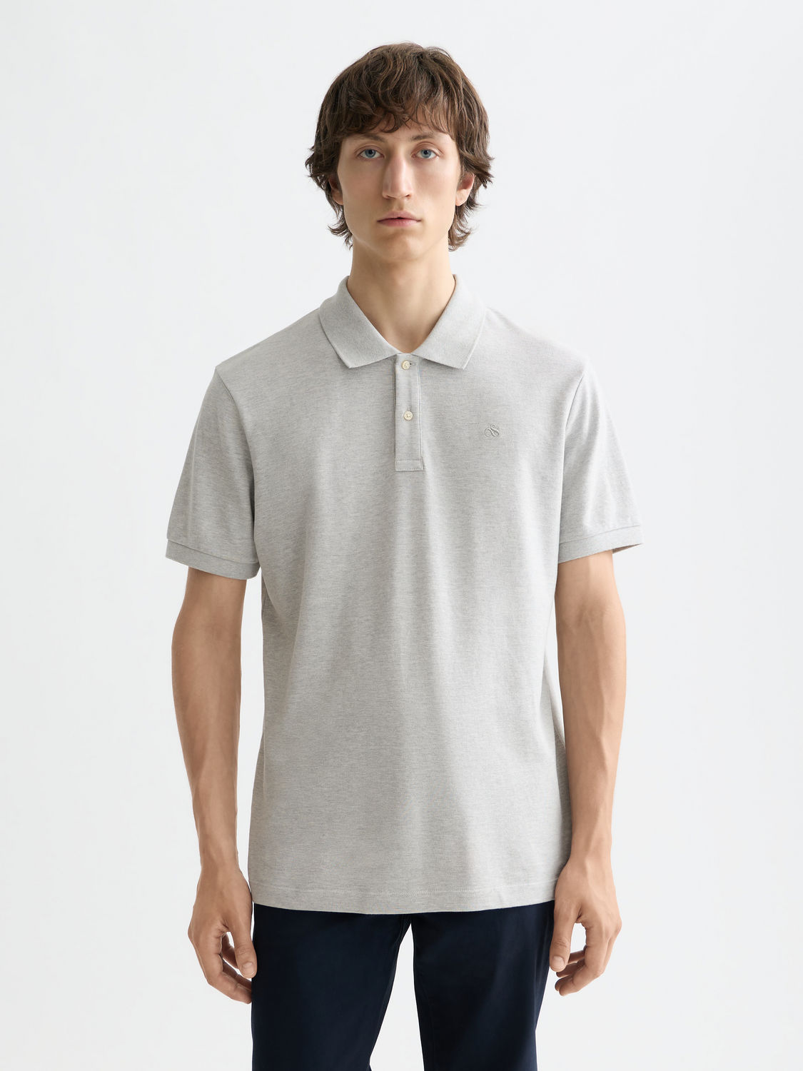 Scotch & Soda logo pique polo shirt in navy with collar and short sleeves, showing detailed fabric texture and branding.