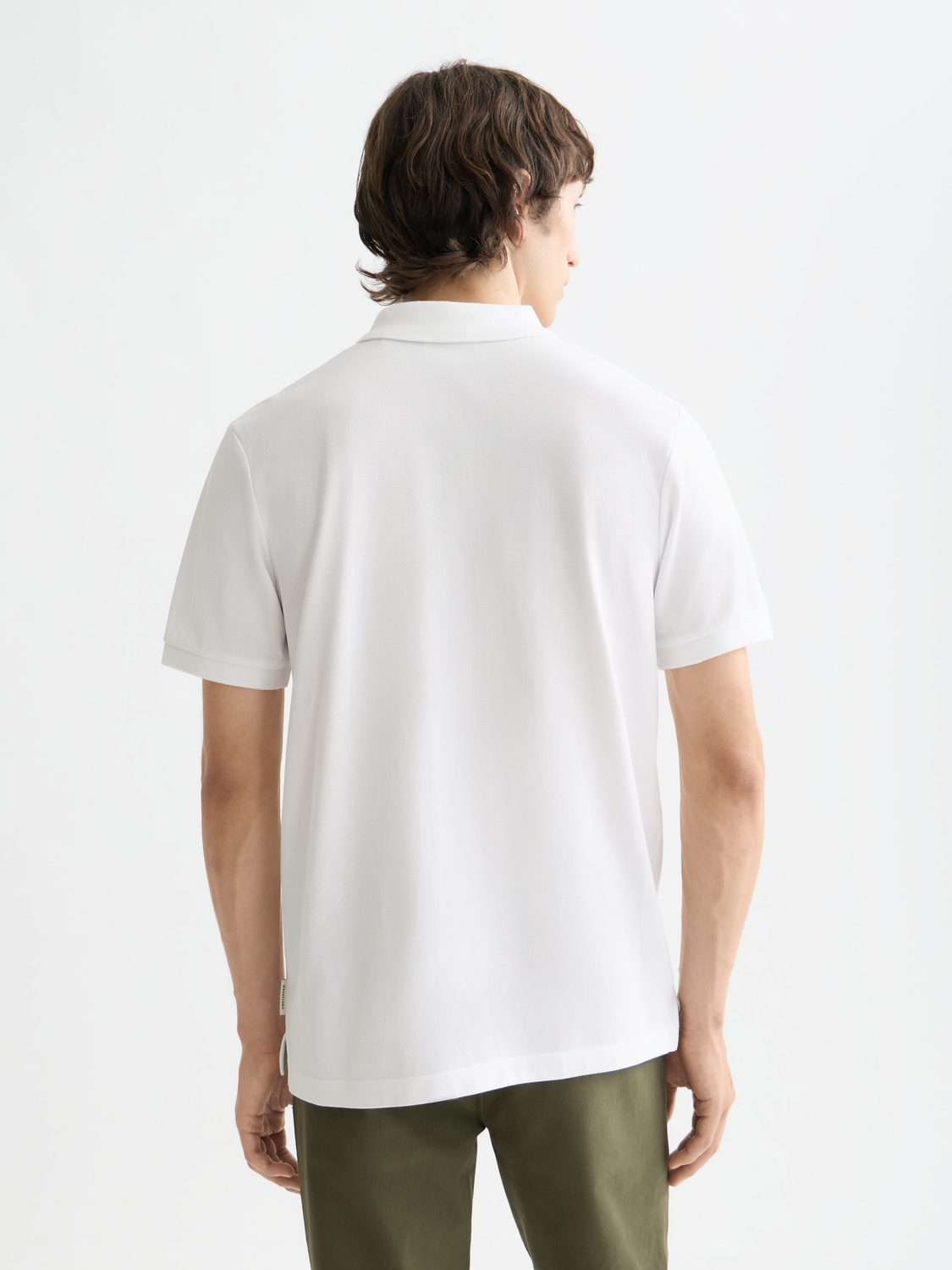Navy blue Scotch & Soda logo pique polo shirt with a classic collar and short sleeves, displayed flat.