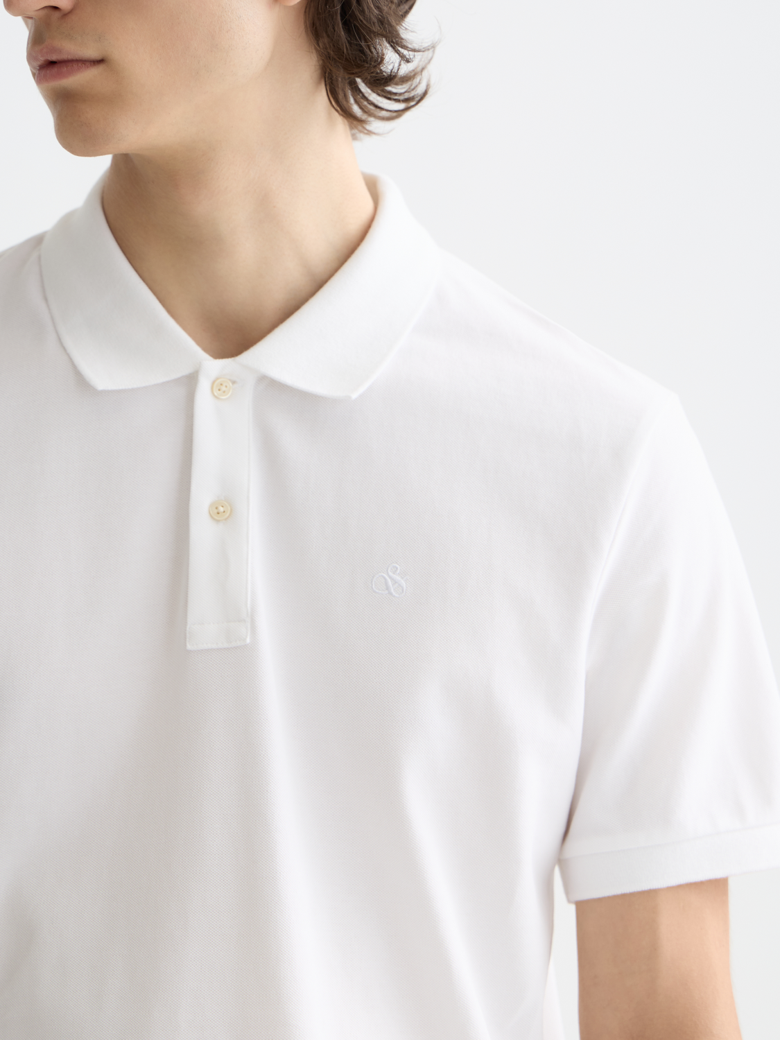 Scotch & Soda logo pique polo shirt with classic collar and short sleeves, featuring the brand's logo embroidery on the chest.