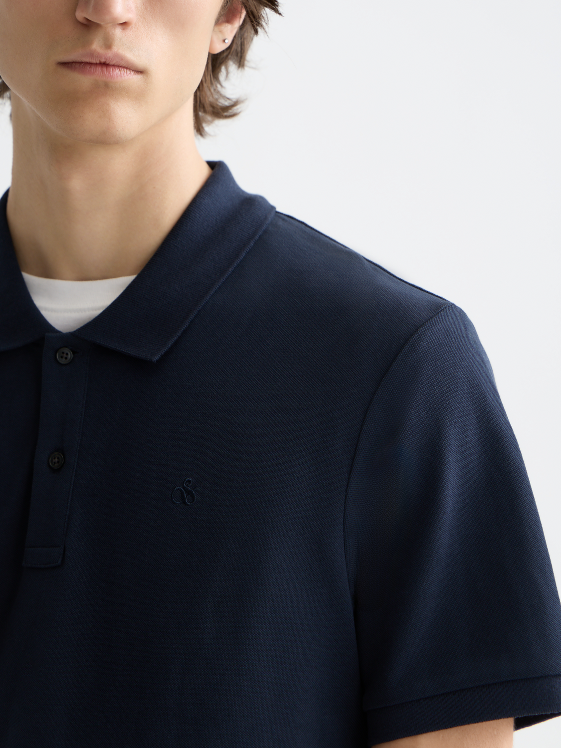 Navy logo pique polo shirt by Scotch & Soda featuring a classic collar and short sleeves.